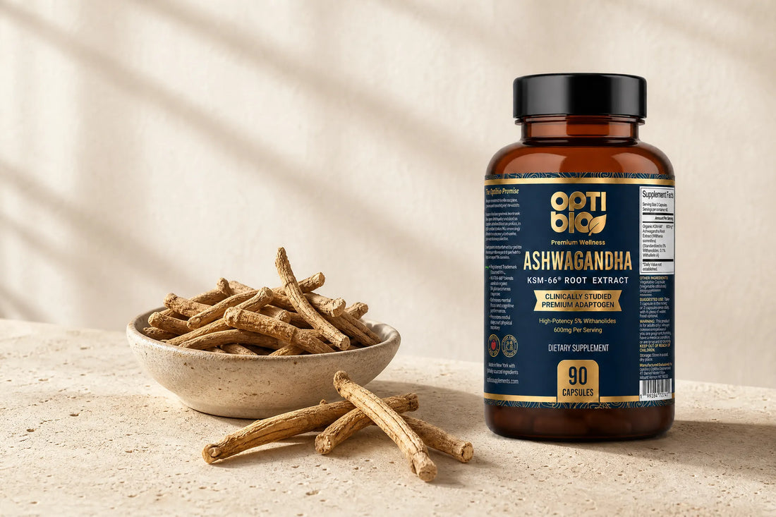 Optibio KSM-66 Ashwagandha root extract bottle beside dried ashwagandha roots on a warm stone surface